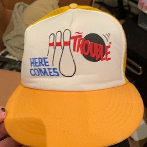 Vintage “Here Comes Trouble” bowling trucker hat